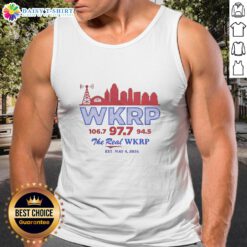Alt Text: Retro tank top featuring the Good WKRP 106.7, 97.7, and 94.5 logo with a city skyline, Est. May 4, 2026.