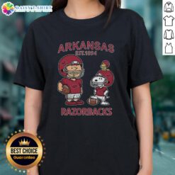 Official Charlie Brown and Snoopy Arkansas Razorbacks NCAA Football tee for ladies, established 1894, stylish and fun.