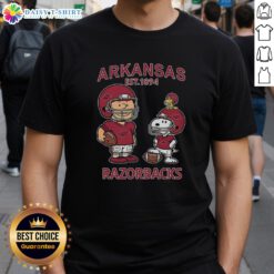 Official Charlie Brown and Snoopy Arkansas Razorbacks NCAA Football T-Shirt, Est 1894, featuring playful graphics.
