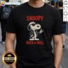 Alt Text: Premium Snoopy Rock And Roll Cartoon T-Shirt featuring Snoopy playing guitar in a vibrant, colorful design.