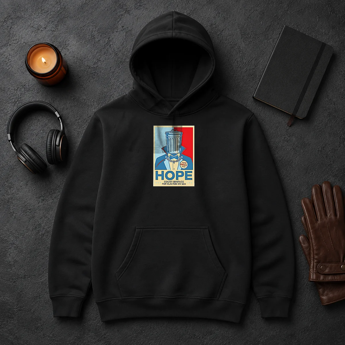 Official Count Binface For Clacton On Sea Hope Hoodie Official Count Binface For Clacton On Sea Hope Hoodie in black, featuring a comfortable pullover style with front pocket and drawstring hood