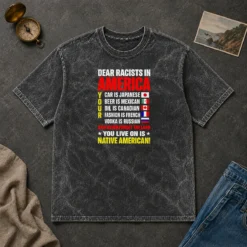 Official Dear Racists In America You Live On Is Native American printed on a soft washed t shirt in light gray