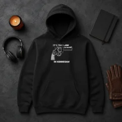 Original Hot It'S The Law In Kennesaw Gun Revolver Hoodie in black, featuring bold graphic print on front