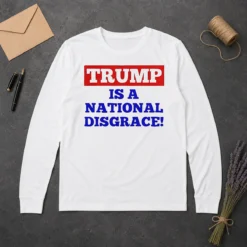 Original Trump Is A National Disgrace Political Protest Long Sleeve Shirt in black, featuring bold white text on the front