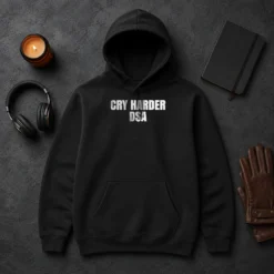 Top Awesome Cry Harder DSA Political Satire Hoodie in black, front view with kangaroo pocket and drawstring hood